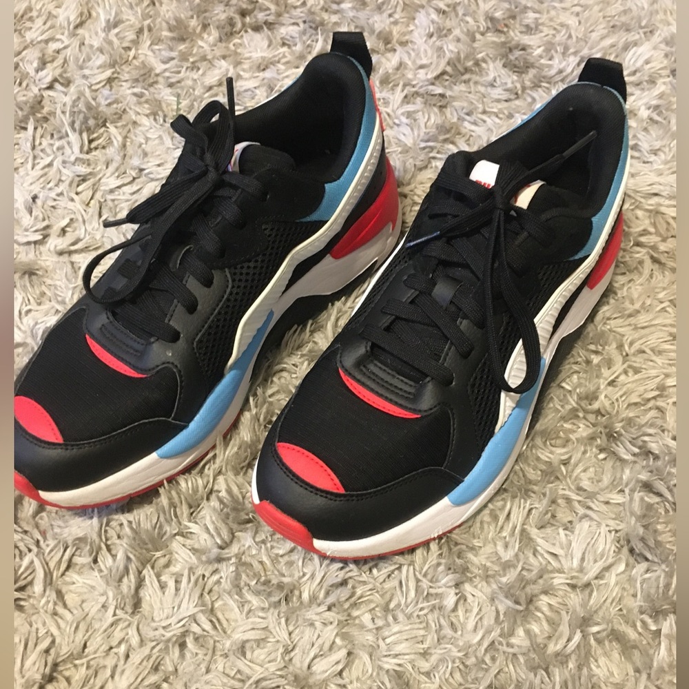 Black red and light blue Pumas